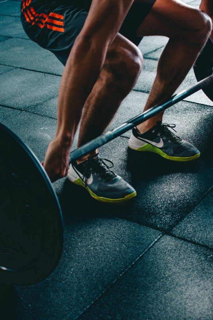 pexels photo 841130 841130 Man performing a deadlift exercise in a gym, demonstrating strength and fitness.